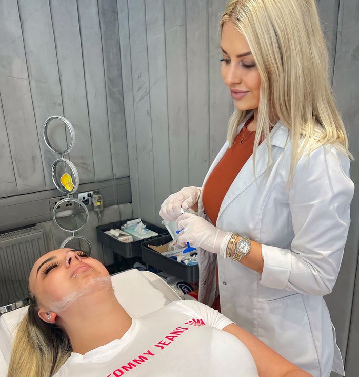 Practitioner treating a client in a Group clinic