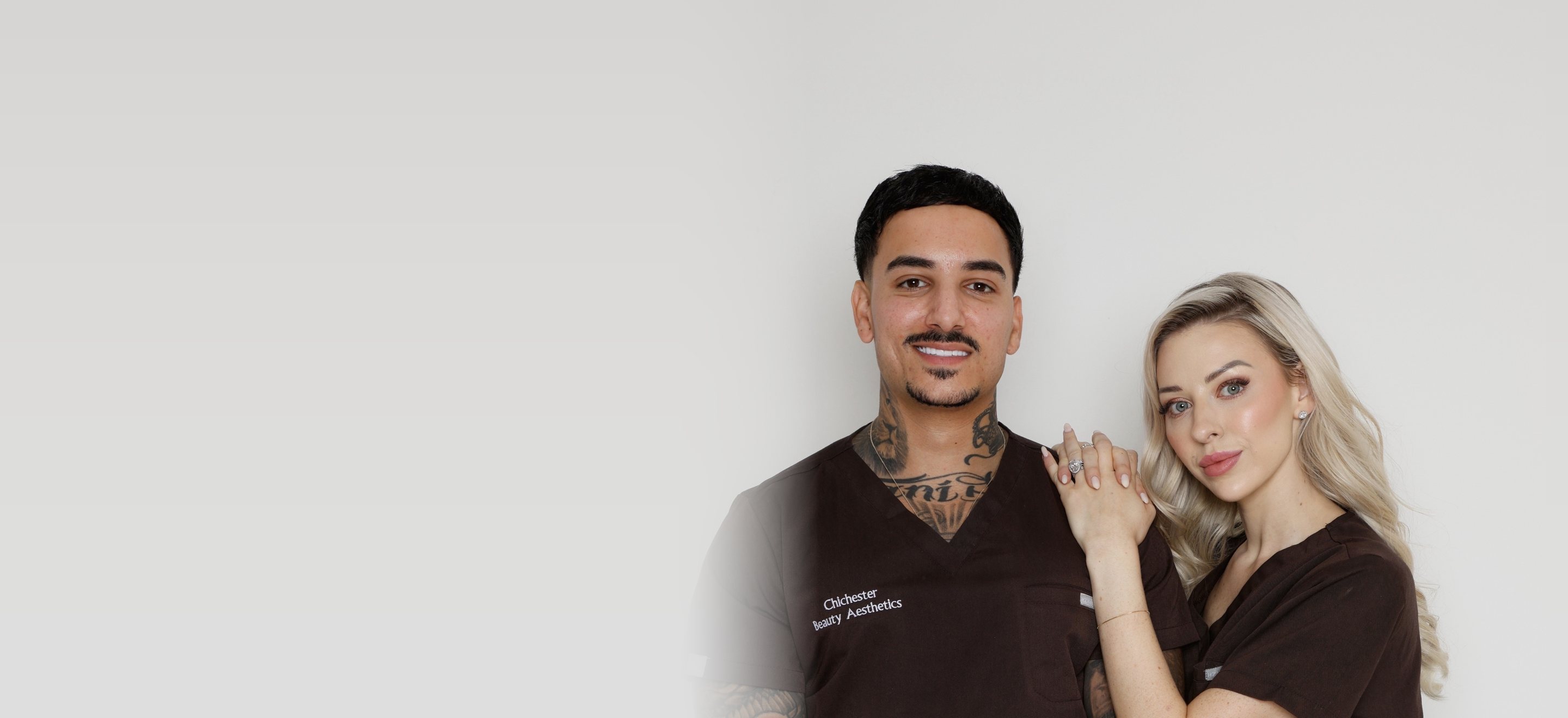 Tanisha and Michael in clinic scrubs