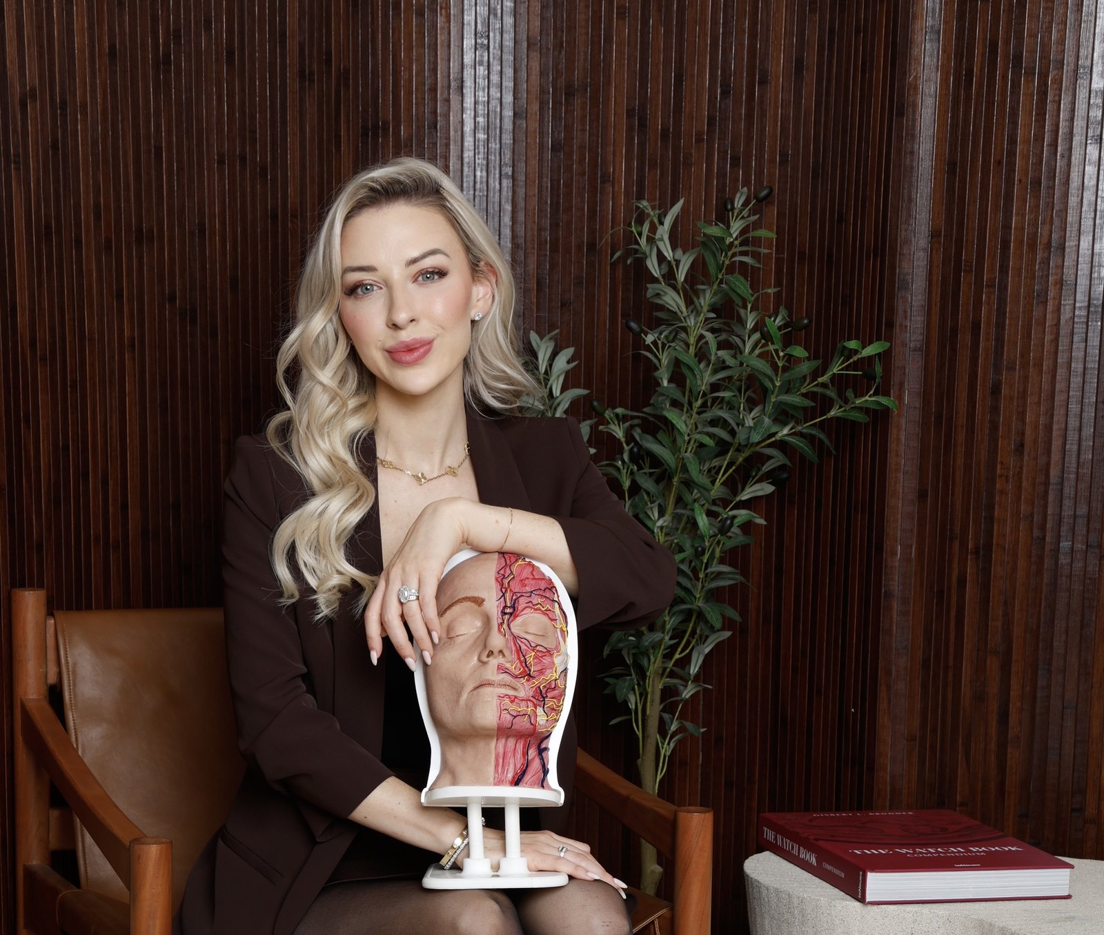 Tanisha Allen, Group Founder, holding an anatomy model