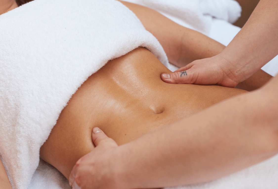 A body lymphatic drainage massage over the abdomen